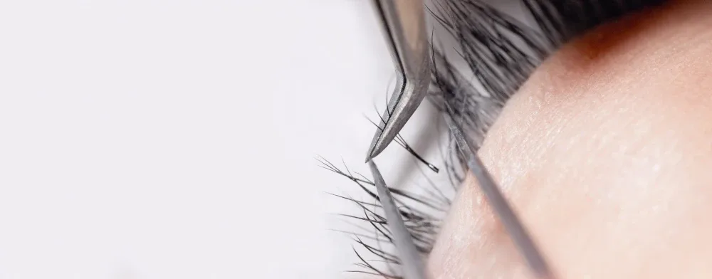 A macro shot of healthy, well-applied eyelash extensions, illustrating that breaks are not always necessary.