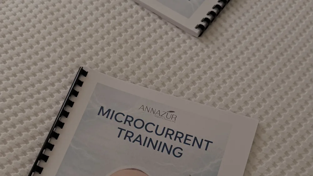 ANNAZUR Microcurrent Training workbook on a treatment surface